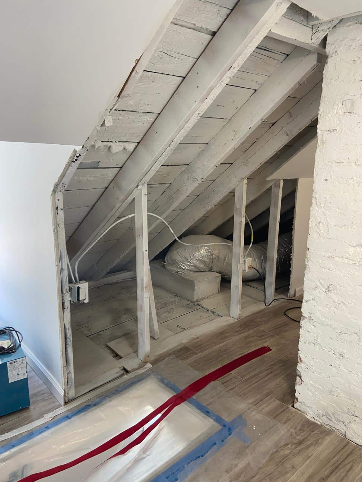 Thermal imaging camera scanning a wall surface in a pre-war co-op apartment