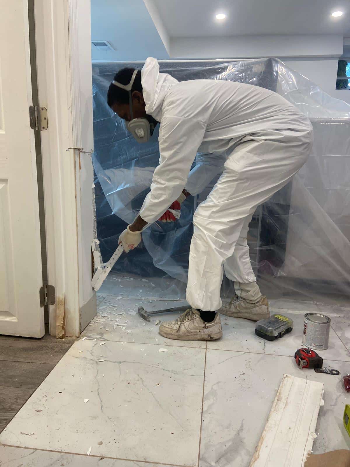 Contaminated drywall cut away to expose framing during licensed mold removal
