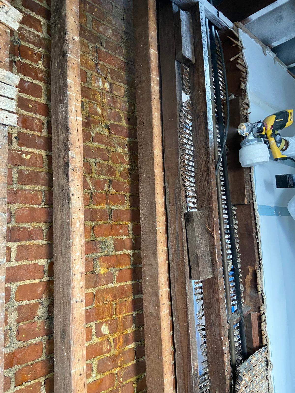HEPA air scrubber running inside a sealed containment zone during mold removal