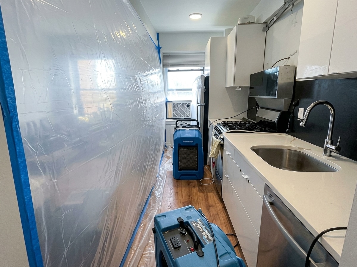 Containment barriers and drying equipment installed in a multi-unit Brooklyn building
